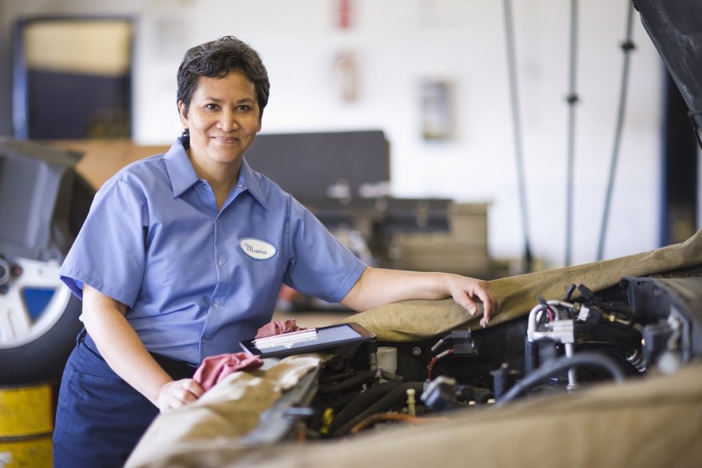 Portrait of female mechanic in auto repair shop