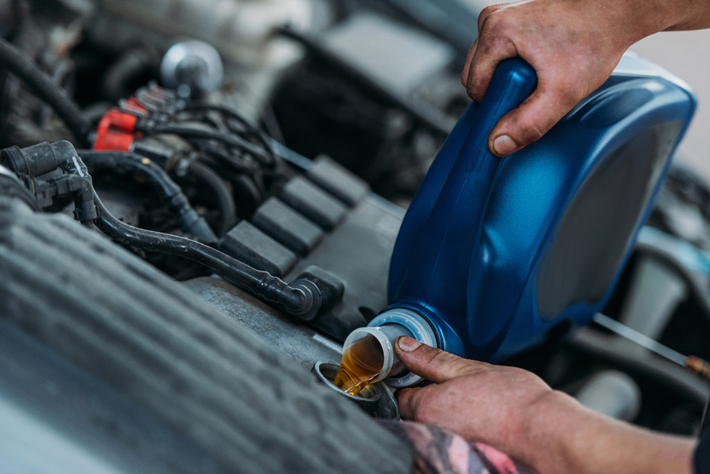 Mechanic changing oil