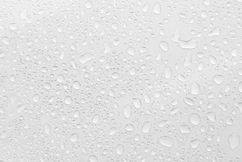 Water droplets on clear surface